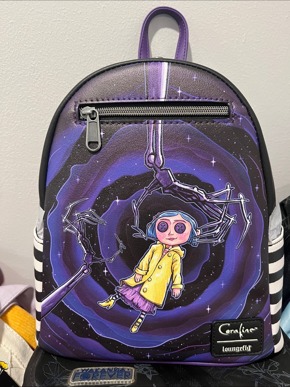 Loungefly Purple Coraline Mini Backpack with Yellow Coat Artwork
